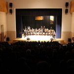 L'Ensemble, sota la direcció de Fernando Cantó Salinas, foren els encarregats d'encetar la vetlada musical amb 3 peces magistrals. Aquesta formació va nàixer per iniciativa de l'Escola de música tradicional de la ciutat de València, amb la finalitat d'estudiar, fomentar i innovar a l'àmbit de la cultura i la música tradicional valenciana. Tot i la seua joventut, l'Ensemble està format per músics veterans que avalen la qualitat i el prestigi de cada so a les composicions. Al Tall rep el reconeixement 'Passet a Passet' a l'onzé Festival de Colles de Cocentaina